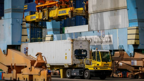 Workers unload a container with millions of eggs imported from Spain at Ashdod Port on April 5, 2020. Credit: Flash90.