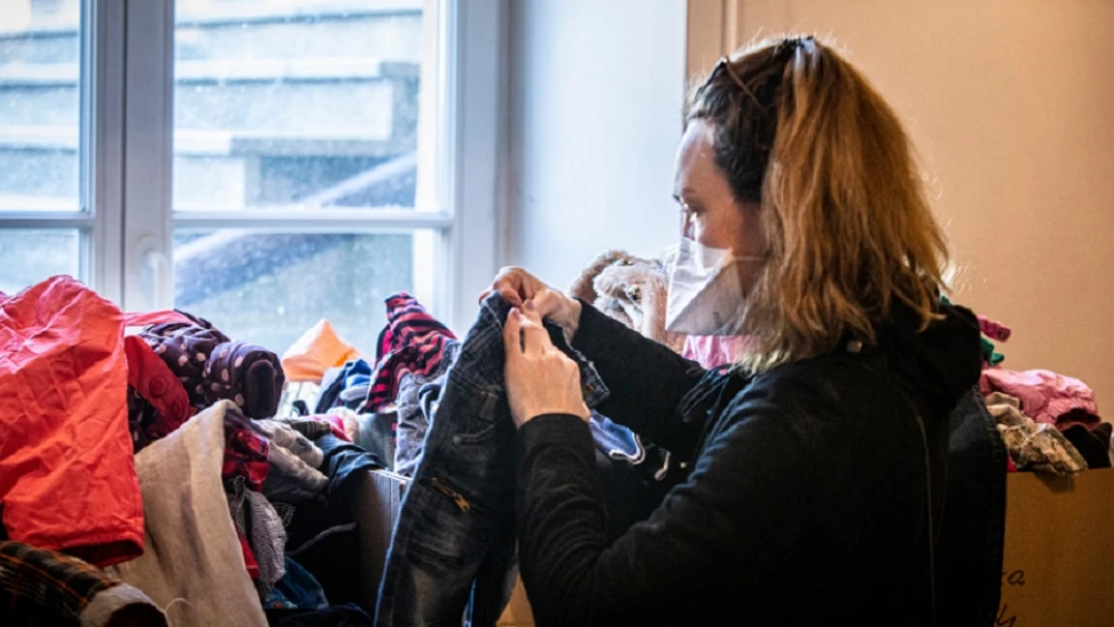 A woman packs items to be sent to those in need in Ukraine. Credit: Jewish Federation of North America.