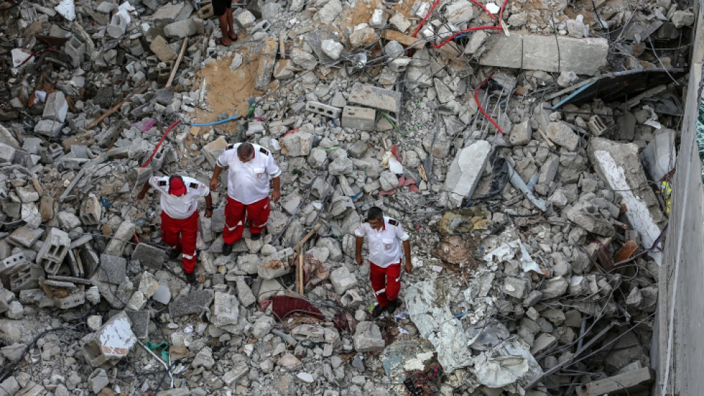 Palestinians gather at the scene where senior Palestinian Islamic Jihad commander Khaled Mansour was killed by an Israeli airstrike, in Rafah in the southern Gaza Strip, on Aug. 7, 2022. Photo by Attia Muhammed/Flash90.