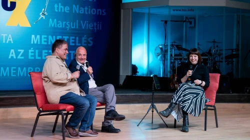 Former Israeli hostage Louis Har (center) addresses the March of Life conference in Germany on February 14, 2025. Credit: Courtesy