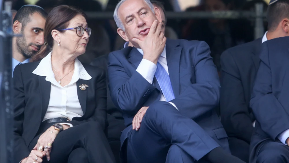 Israeli Prime Minister Benjamin Netanyahu with Supreme Court Chief Judge Esther Hayut during a memorial service marking 22 years since the assassination of Israeli Prime Minister Yitzhak Rabin, held at Mount Herzl cemetery in Jerusalem on Nov. 1, 2017.