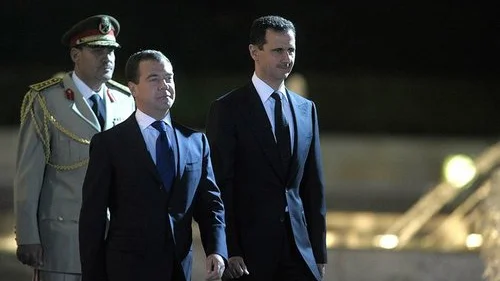 Syrian President Bashar Assad (right) with Russian Prime Minister Dmitriy Medvedev. Credit: Presidential Press and Information Office.