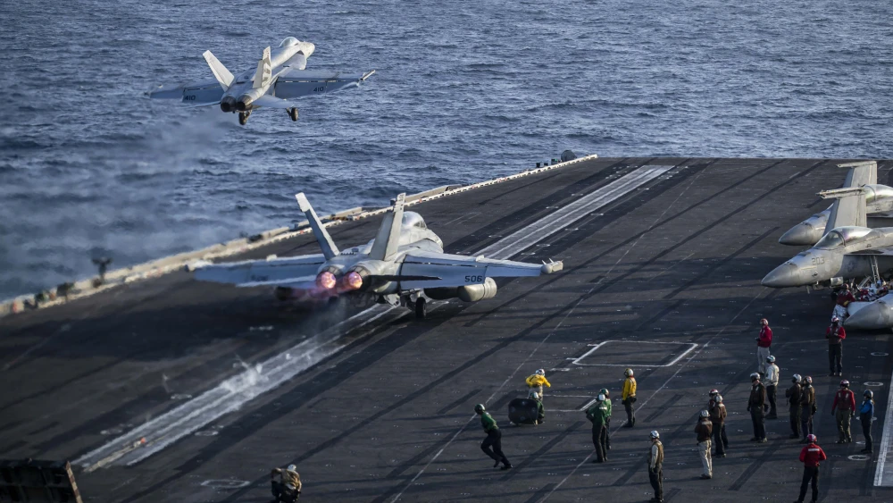 An F/A-18E Super Hornet assigned to Strike Fighter Squadron 151 and an EA-18G Growler assigned to Electronic Attack Squadron 133 launch from the flight deck of the Nimitz-class aircraft carrier USS Abraham Lincoln in the U.S. 5th Fleet area of operations, May 9, 2026. U.S. Navy photo by NAVCENT Public Affairs.