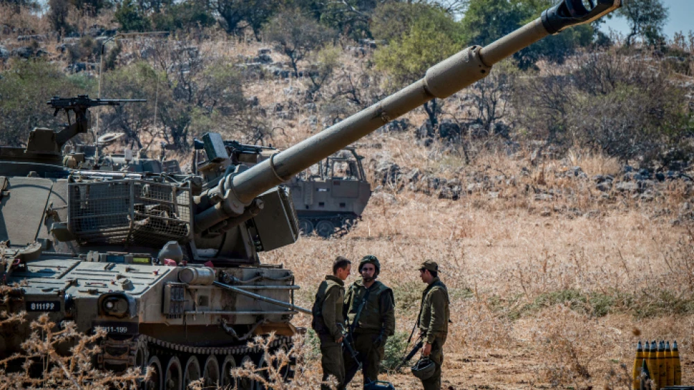 Israeli soldiers stand next to artillery units near the Lebanese border in northern Israel, on Sept. 1, 2019. Photo by Basel Awidat/Flash90.