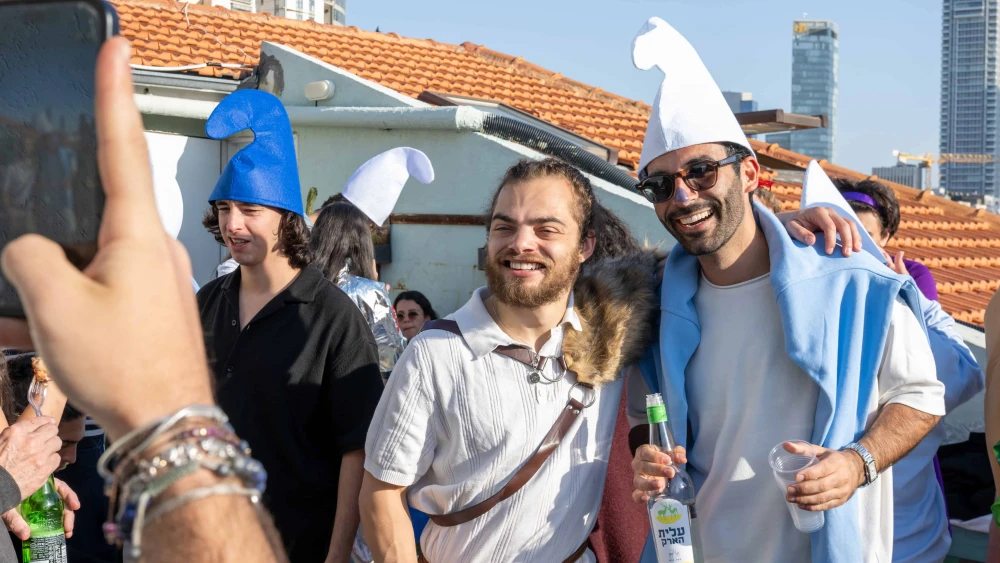 People dressed in costume pose for photos