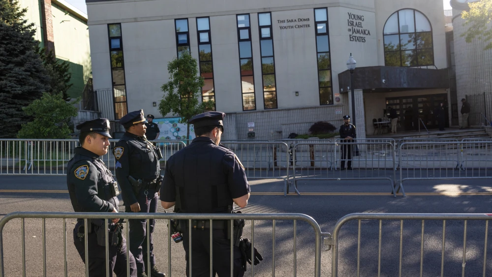 New York City police officers fence off and guard the Jewish Orthodox synagogue Young Israel of Jamaica Estates, on May 12, 2026, in the borough of Queens, New York City. Photo by Andrew Lichtenstein/Corbis via Getty Images.