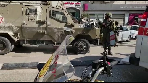 Soldiers secure the scene of a deadly shooting in Huwara, near Nablus, Feb. 26, 2023. Photo by Nasser Ishtayeh/Flash90.