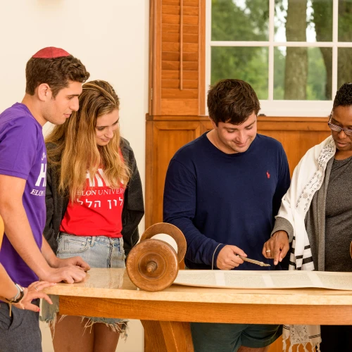 Students at Elon University in North Carolina read from the Torah. Credit: Elon University Hillel.