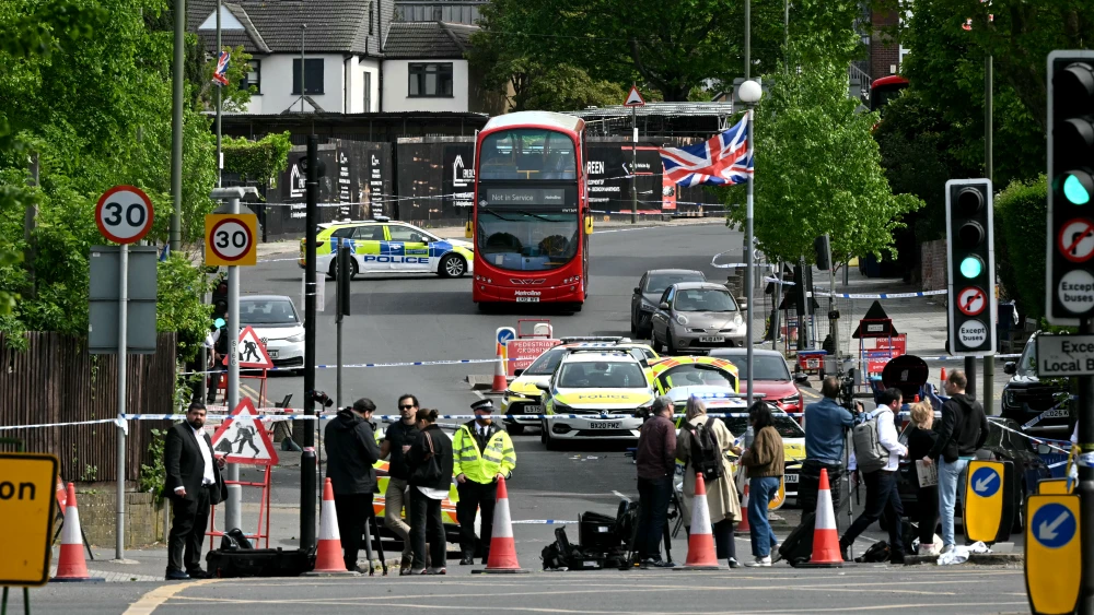 Members of the media gather at a police cordon following the stabbing of two people, along with the arrest of a suspect, in North London, April 29, 2026. Photo by Justin Tallis/AFP via Getty Images.