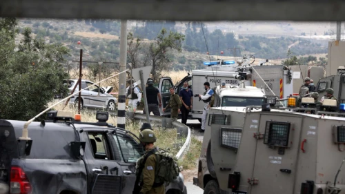 Israeli soldiers at the scene of what the Israeli military says was a deliberate car-ramming attack near the Hebron Hills in Judea and Samaria on May 14, 2020. Photo by Wisam Hashlamoun/Flash90.