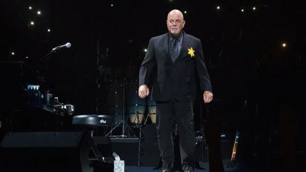 Billy Joel sports a yellow star on his jacket during a concert at New York City’s Madison Square Garden. Credit: Billy Joel via Twitter.
