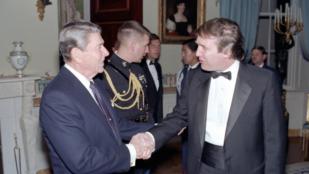 President Reagan Hosts Reception In The White House US President Ronald Reagan (1911 - 2004) shakes hands with real estate developer Donald Trump in a reception line in the White House's Blue Room, Washington DC. November 3, 1987. The reception was held for members of the Friends of Art and Preservation in Embassies Foundation. (Photo by White House Photo Office/PhotoQuest/Getty Images)