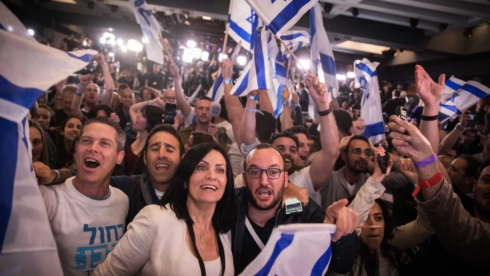 Supporters of the Blue and White Party react to the first voting results in Israel's national elections at party headquarters in Tel Aviv, on April 9, 2019. Credit: Hadas Parush/Flash90.