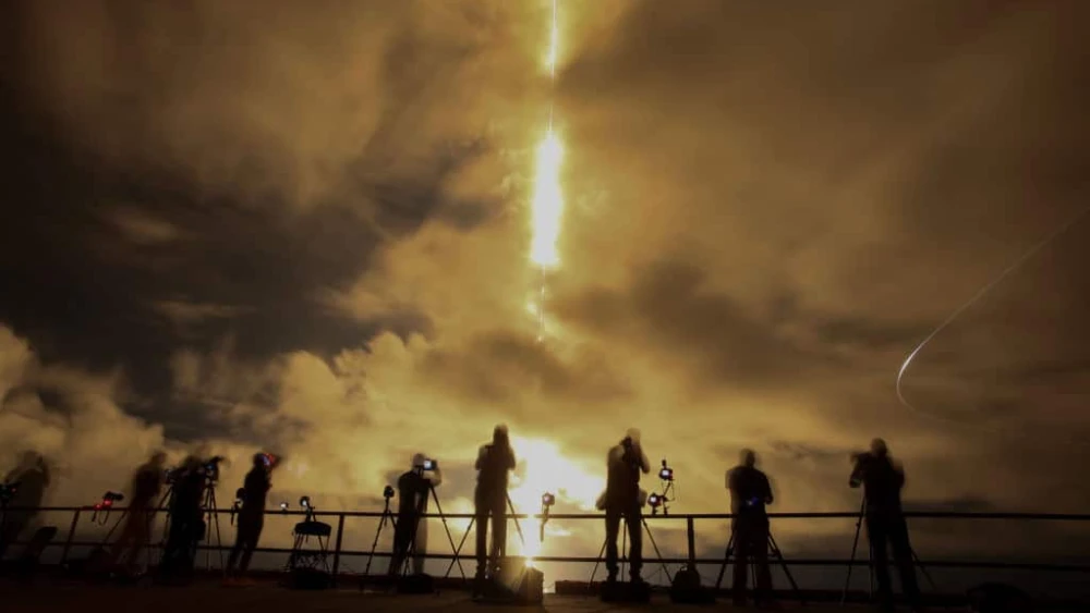 A slow shutter speed captures a streak of light from the engines on SpaceX's Polaris Dawn Falcon 9 rocket as it blasts off from Launch Complex 39A of NASA's Kennedy Space Center in Cape Canaveral, Florida, on Sept. 10, 2024. Photo by Joe Raedle/Getty Images.