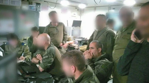 Former OC 162nd Division, Maj. Gen. Itzik Cohen, and the former commander of the Shayetet 13 naval commando unit, Col A., look on from the Command Center overseeing the operation to recover Staff Sgt. Oron Shaul’s body. Credit: IDF.