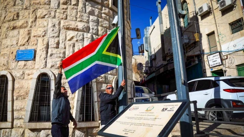Bethlehem municipality employees raise a South African flag as a sign of support for the country's suit against Israel to the International Court of Justice, Bethlehem, Jan. 16, 2024. Credit: Wisam Hashlamoun/Flash90.