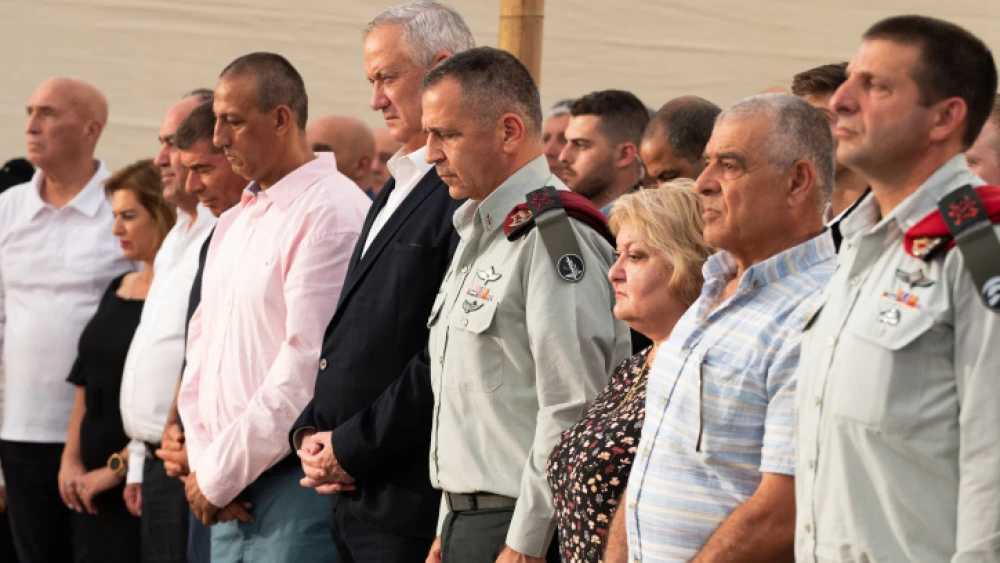 Israeli Defense Minister Benny Gantz (fifth from right) and IDF Chief of Staff Lt. Gen. Aviv Kochavi (fourth from right) at the inauguration ceremony for a new monument in memory of fallen soldiers of the South Lebanon Army (SLA), in Metula, northern Israel, July 4, 2021. Photo by Basel Awidat/Flash90.