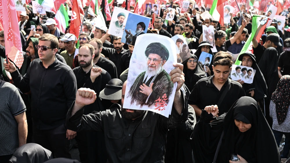 Iranian regime supporters march through Tehran as they await the funeral procession of slain Supreme Leader Ali Khamenei, July 6, 2026. Photo by Wakil Kohsar/AFP via Getty Images.