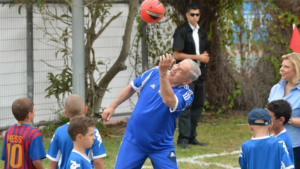 Israeli Prime Minister Benjamin Netanyahu plays soccer with young children sick with cancer and F.C. Barcelona players in Jaffa's Bloomfield Stadium, near Tel Aviv, Aug. 4, 2013. Photo by Yossi Zeliger/Flash90.