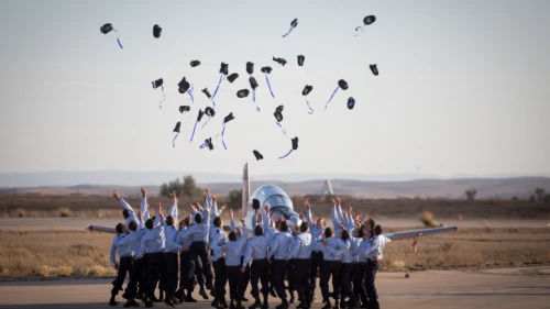 Air Force pilots throw their hats in the air in celebration at a graduation ceremony for soldiers who have completed the official IAF flight course (Hatzerim Air Base, Negev Desert), Dec. 29, 2016. Photo by Miriam Alster/Flash90.