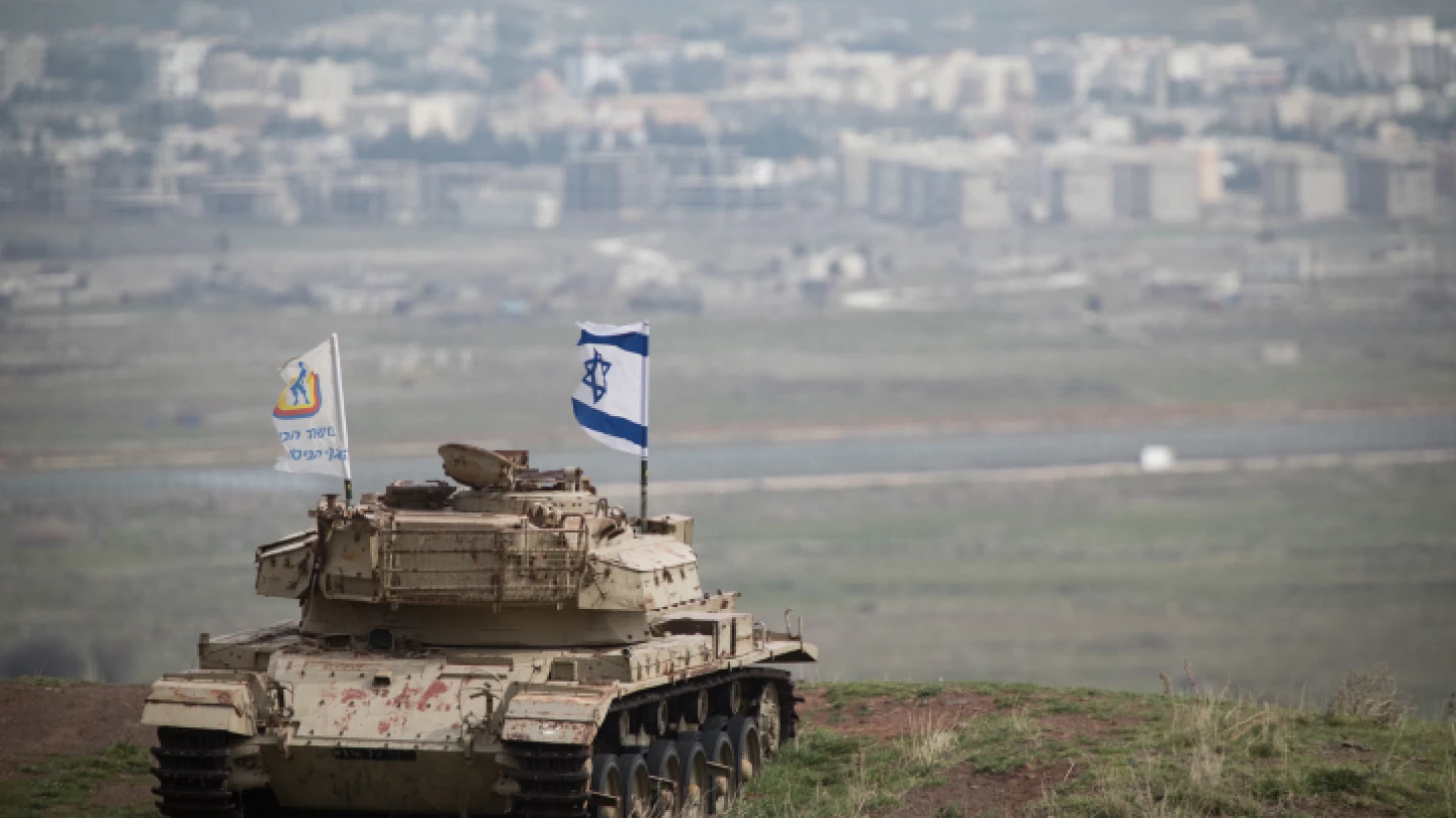 An old Israeli tank with a flag overlooking the Syrian town of Quneitra in the Golan Heights on Feb. 11, 2018. Photo by Hadas Parush/Flash90.