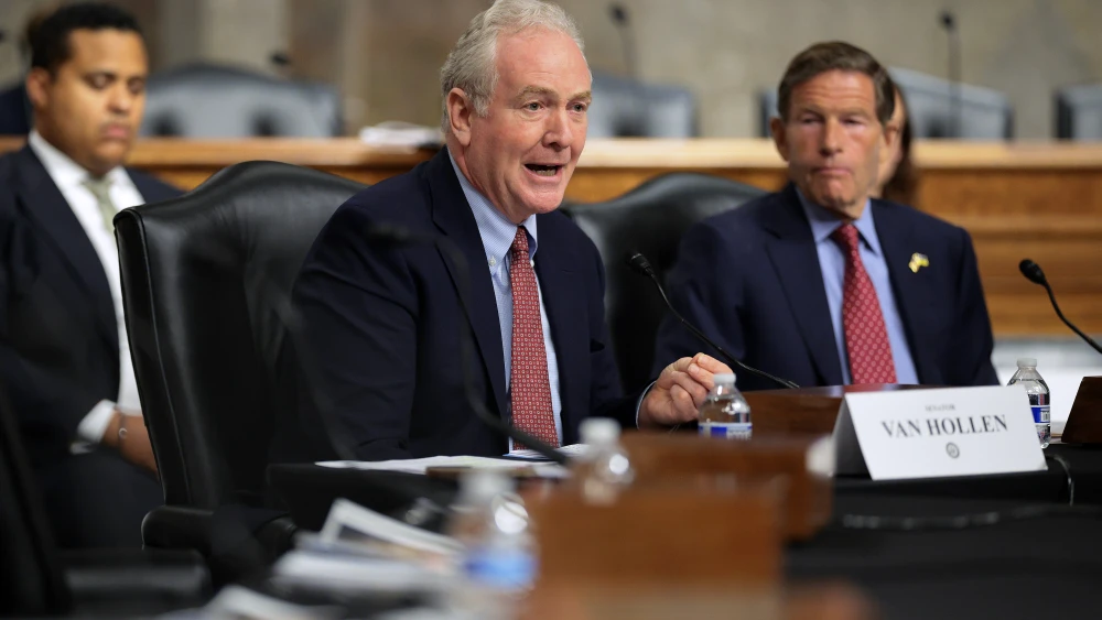 Sen. Chris Van Hollen (D-Md.), center, and Sen. Richard Blumenthal (D-Conn.), right, host a forum to discuss President Donald Trump’s official and personal dealings with cryptocurrency in the Dirksen Senate Office Building on Capitol Hill in Washington, July 27, 2026. Photo by Chip Somodevilla/Getty Images.