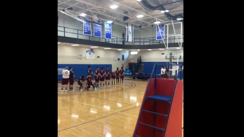 Two Brooklyn College students kneeling during a rendition of Israel's national anthem at a match against Yeshiva University on Feb. 23, 2020. Source: Screenshot.