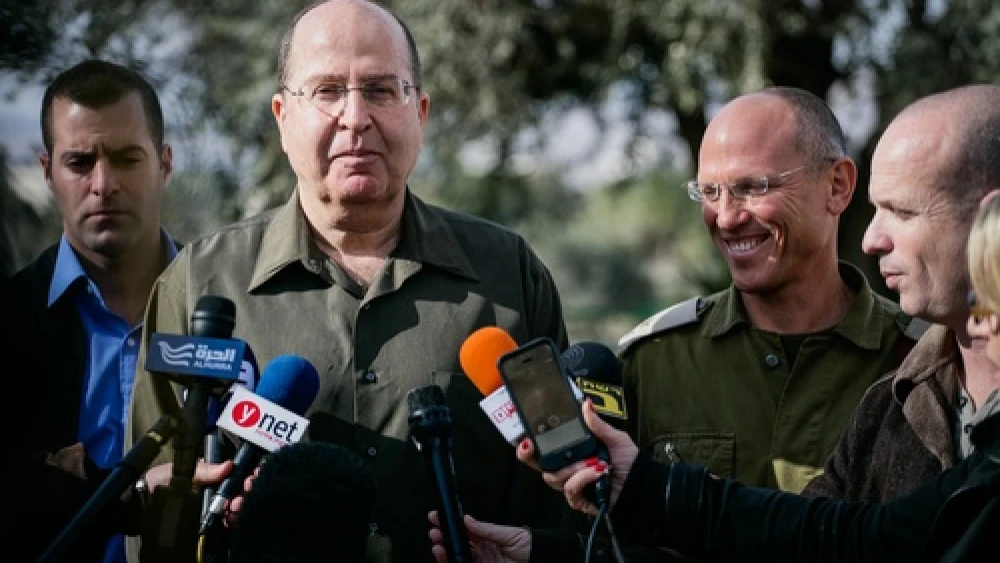 Israeli Defense Minister Moshe "Boogie" Ya'alon gives a statement to the media during a visit to the IDF Central Command on Jan. 7, 2014. The Israeli newspaper "Yediot Achronot" on Jan. 14 quoted Ya'alon as saying U.S. Secretary of State John Kerry's approach to Israeli-Palestinian conflict negotiations is an obsession" and "messianic," igniting a diplomatic stir. Photo by Flash90.