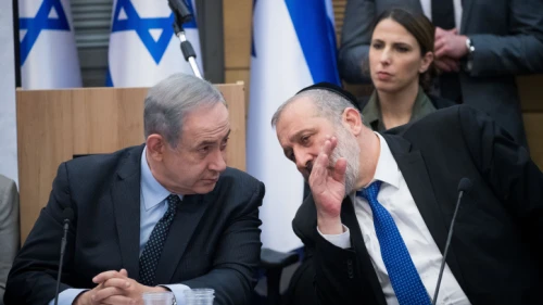 Israeli Prime Minister Benjamin Netanyahu speaks with Shas Party chairman Aryeh Deri during a meeting with the heads of the right-wing parties on March 4, 2020. Photo by Yonatan Sindel/Flash90.