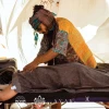 Dor Kapah gives a massage to a music festival participant. Photo by Inor Kagno.