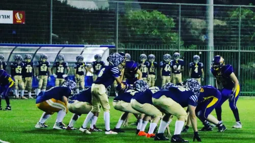 Israeli children participate in a American Football game as part of the “Young Champions” program founded by Erez Lustig, an Israeli nonprofit that today brings together 200 girls and boys, ages 6 to 16, on four teams that practice after school. Credit: Courtesy.
