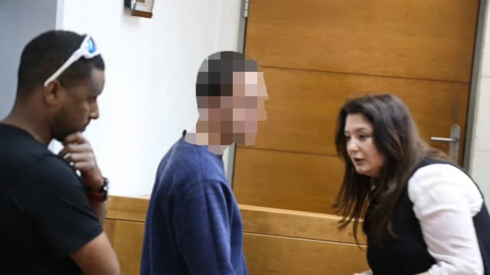 A man brought for a court hearing at the Rishon Lezion Magistrate's Court, under suspicion of Issuing fake bomb threats against Jewish institutions around the world, on March 23, 2017. Photo by Flash90.