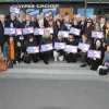 Participants of the Jewish Federations of North America mission to Paris pose in front of the Hyper Cacher kosher grocery in February 2015, where four Jewish shoppers were killed weeks before in an Islamist terror attack. Credit: The Jewish Federations of North America.
