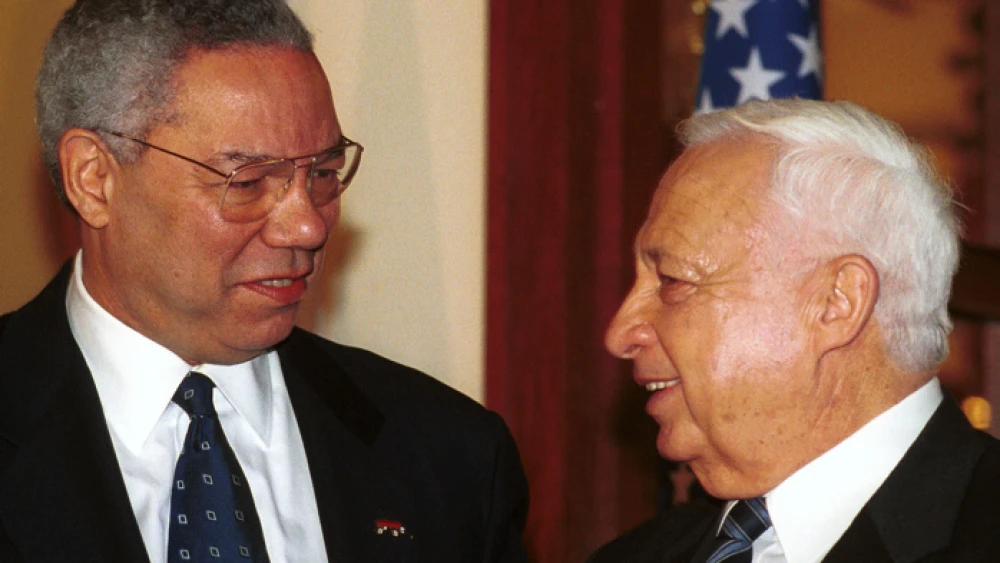 Former U.S. Secretary of State Colin Powell meets with Israeli Prime Minister-elect Ariel Sharon in 2001. Credit: Shauli Shem-Tov/Flash90.