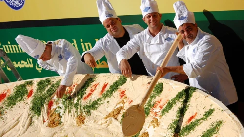 Employees of the Abu Gosh restaurant prepare a 4-ton bowl of hummus with the goal of attaining the Guinness World Record title in 2010. The previous title owner was Lebanon, whose record was 2 tons of hummus. Photo by Rachael Cerrotti/Flash 90.