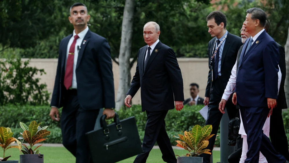 Russia's President Vladimir Putin walks alongside China's President Xi Jinping and India's Prime Minister Narendra Modi during the 18th BRICS Summit in New Delhi on Sept. 12, 2026. Photo by Alexander Kazakov/Pool/AFP via Getty Images.