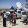 Media representative broadcast from the Israel-Gaza border on the second day of “Operation Protective Edge,” July 9, 2014. Credit: Yonatan Sindel/Flash90.