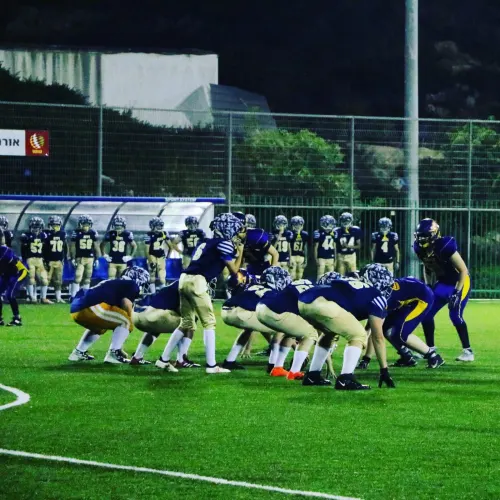 Israeli children participate in a American Football game as part of the “Young Champions” program founded by Erez Lustig, an Israeli nonprofit that today brings together 200 girls and boys, ages 6 to 16, on four teams that practice after school. Credit: Courtesy.