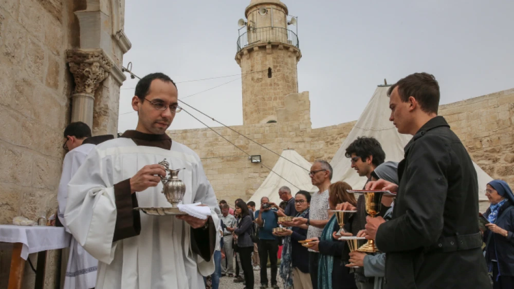Worshippers visit the Chapel (and Mosque) of the Ascension, a Christian and Muslim shrine located on the Mount of Olives, during the Ascension holiday, on May 10, 2018. Photo by Yossi Zamir/Flash90