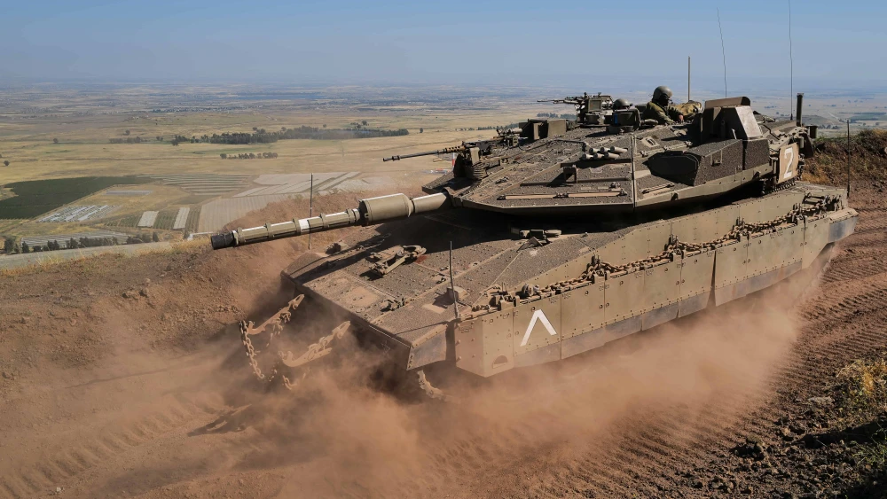 IDF tank soldiers from the 53rd Battalion of the 188th Tank Brigade on alert in a military outpost overlooking Syrian villages near the Israeli border in the southern Golan Heights on May 23, 2022. Photo by Michael Giladi/ Flash90.