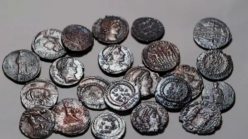 The rare hoard of 22 copper coins over 1,600 years old discovered in the Lower Galilee. Credit: Emil Aladjem, Israel Antiquities Authority.