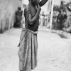 A photograph of an enslaved boy in Zanzibar, circa 1890. The original image states: "An Arab master's punishment for a slight offense." Credit: Public Domain via Wikimedia.