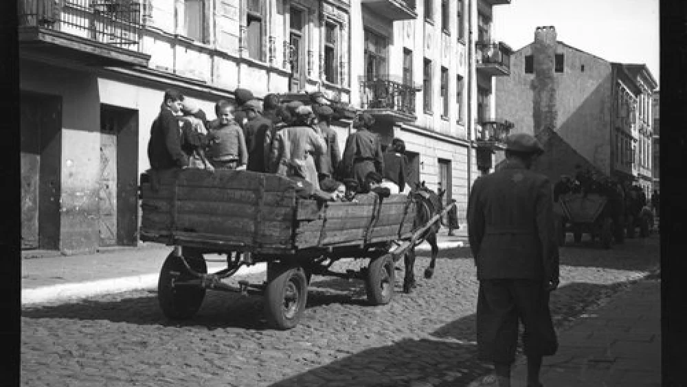 Children are transported from the Lodz Ghetto to the Nazi concentration camp of Chelmno in 1942, in one of the photos on display as part of the “Memory Unearthed: The Lodz Ghetto Photographs of Henryk Ross” exhibit. Credit: Courtesy Museum of Fine Arts, Boston.