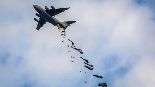 A plane drops aid loaded with food to Palestinians in the Gaza Strip, Oct. 17, 2024. Photo by Abed Rahim Khatib/Flash90.