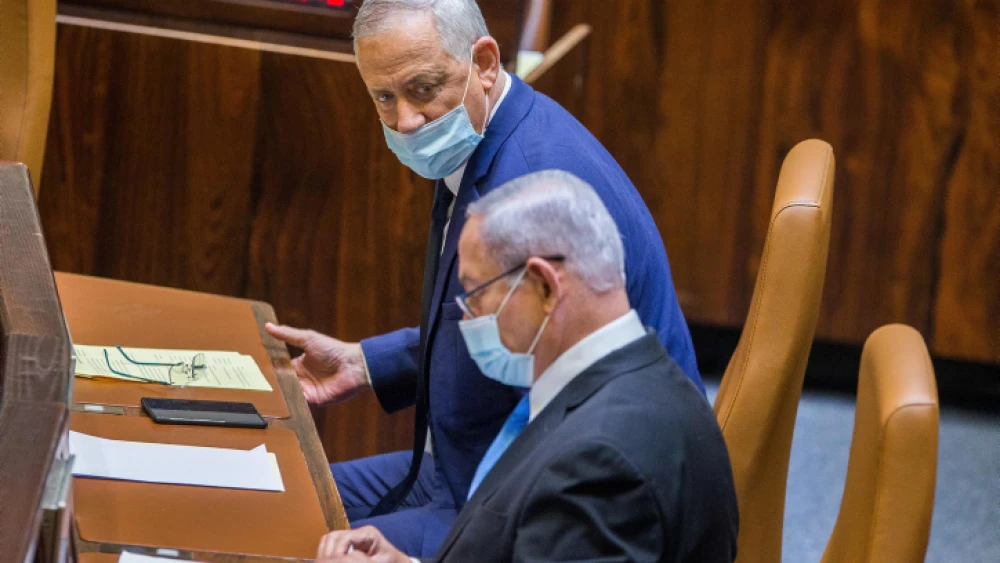 Israeli Defense Benny Gantz and Prime Minister Benjamin Netanyahu during a vote at the Knesset in Jerusalem on Aug. 24, 2020. Photo by Oren Ben Hakoon/POOL.