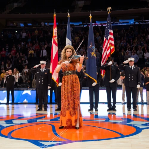 The violinist Miri Ben-Ari performs during the Euro Classic between Maccabi FOX Tel-Aviv and EA7 Armani Milano in Madison Square Garden in New York City on Oct. 4, 2015. Credit: Shutterstock.