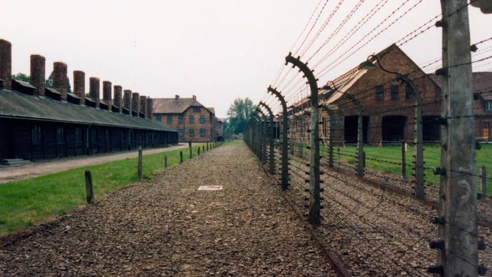 The site of the former Auschwitz concentration camp in Poland. A controversial new law passed by Poland's parliament is rooted in Polish resentment when Auschwitz and other Nazi German concentration camps are referred to as “Polish death camps.” Credit: Giraud Patrick via Wikimedia Commons.