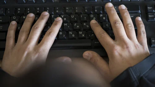Typing on a Hebrew keyboard. Credit: Flash90.