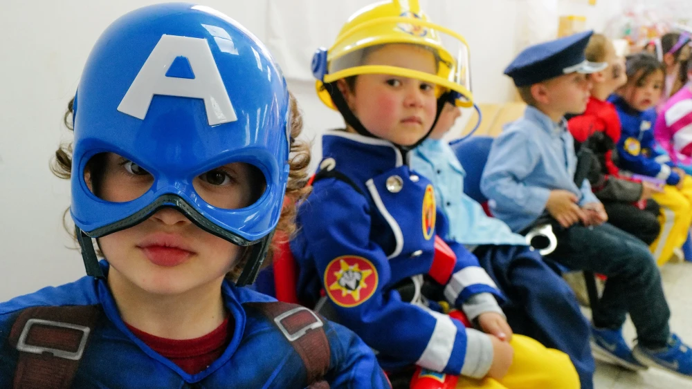 Kids dress up for Purim at a school in Katzrin in the Golan Heights, March 5, 2023. Photo by Michael Giladi/Flash90.