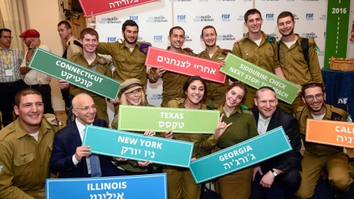 A group of lone soldiers in the Israel Defense Forces with Mindy Levine, wife of president of the New York Yankees Randy Levine, and co-founders of Nefesh B'Nefesh Rabbi Yehoshua Fass and Tony Gelbart, during “Yom Siddurim,” or “personal errands day,” on Jan. 24, 2018. Photo by Shahar Azran.